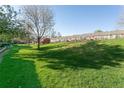 Lush green backyard offering ample space for outdoor activities at 2901 W Rowland Ave, Littleton, CO 80120