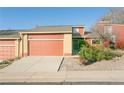 Charming home featuring a two-car garage, brick accents, and a well-maintained front yard at 2901 W Rowland Ave, Littleton, CO 80120