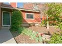 Well-manicured front yard leading to the front door of a charming home at 2901 W Rowland Ave, Littleton, CO 80120
