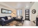 Comfortable living room with modern decor, a stylish rug, and plenty of natural light from the window at 5332 13Th St, Frederick, CO 80504