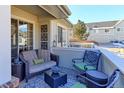 Cozy patio furniture on a small patio with decorative rug at 1176 E 130Th Ave # C, Thornton, CO 80241