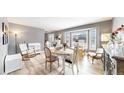 Well-lit dining room with a large window and stylish decor at 982 E 130Th Cir, Thornton, CO 80241