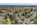 Wide aerial shot of a residential neighborhood with a clear view of the cityscape in the background at 1359 S Brentwood Way, Lakewood, CO 80232