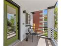 Close-up of front porch with seating and view of greenery, perfect for relaxing at 1845 W 39Th Ave, Denver, CO 80211