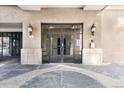 Front entrance to a building with double doors and stone accents at 277 N Broadway # 409, Denver, CO 80203