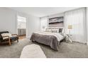 Bedroom boasts soft carpet and modern decor. Includes a spacious bathroom en suite at 5202 Reed St, Arvada, CO 80002