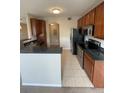 Cozy kitchen with stainless steel appliances and granite countertops at 17346 Nature Walk Trail Trl # 201, Parker, CO 80134