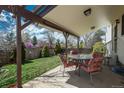 Covered back patio with outdoor seating, perfect for relaxing and entertaining guests at 15930 E Ford Pl, Aurora, CO 80017