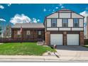 Beautiful home with well maintained lawn, front porch, and two car garage at 15930 E Ford Pl, Aurora, CO 80017