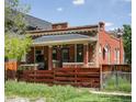 Charming brick home with a cozy front porch and a well-maintained fence at 3914 Osage St, Denver, CO 80211
