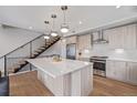 Spacious kitchen with a center island, stainless steel appliances, and contemporary design at 2350 Tremont Pl # 13, Denver, CO 80205