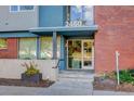 Building entrance with glass doors and brick facade at 2460 W 29Th Ave # 303, Denver, CO 80211