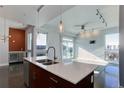 Modern kitchen with island, stainless steel appliances, and open layout at 2460 W 29Th Ave # 303, Denver, CO 80211