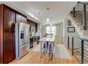 Well-lit open kitchen showcasing stainless steel appliances and a spacious island with seating at 2426 Welton St, Denver, CO 80205