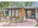 Charming front porch with seating, perfect for relaxing and enjoying the outdoor scenery at 2220 Lee St, Lakewood, CO 80215
