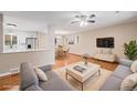 Cozy living room with hardwood floors, and contemporary furniture creating an inviting space at 260 Flint Way, Broomfield, CO 80020