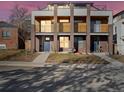 Modern townhome with brick facade, balconies, and clean architectural lines at 845 Eudora St, Denver, CO 80220