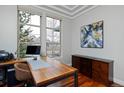 Bright office space featuring large windows, hardwood floors, and a stylish work area at 8044 E 24Th Ave, Denver, CO 80238