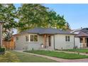 An inviting front yard and classic single story architecture makes this home appealing at 3541 Eudora St, Denver, CO 80207