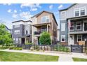 Charming two-story home featuring a fenced yard, balcony and inviting curb appeal at 8883 Ramblestone St, Highlands Ranch, CO 80129