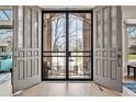 Elegant foyer with decorative glass doors and an inviting view to the outside at 11465 W Atlantic Ave, Lakewood, CO 80227