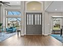 Grand foyer featuring high ceilings, decorative front doors, and views to a lovely sitting room at 11465 W Atlantic Ave, Lakewood, CO 80227
