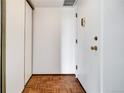 Bright entryway with parquet floors, closet and white walls at 2525 S Dayton Way # 1510, Denver, CO 80231