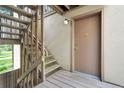 Exterior entry featuring a wood staircase leading to a private door at 2525 S Dayton Way # 1510, Denver, CO 80231