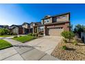 Lovely two-story home with a well-kept lawn, attached garage, and charming curb appeal at 27029 E Irish Pl, Aurora, CO 80016