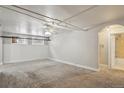 Bright and airy basement bedroom with ceiling fan and carpeted floor at 1050 N Washington St # 1A, Denver, CO 80203