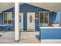 Inviting covered front porch with twin entrances and decorative details at 2838 Decatur St, Denver, CO 80211