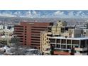 View of commercial and apartment buildings in a snow covered urban area at 790 N Washington St # 1102, Denver, CO 80203