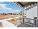 Inviting front porch view showcasing the neighborhood and the home's exterior at 8785 Whiteclover St, Littleton, CO 80125