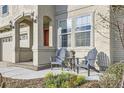 Inviting front porch featuring outdoor seating and well-maintained landscaping at 5072 Cathay St, Denver, CO 80249