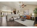 Bright living room features high ceilings, hardwood floors, and neutral decor at 3495 Amber Sun Cir, Castle Rock, CO 80108