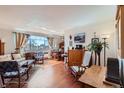 Bright, hardwood living room with a large window overlooking the city, great for entertaining or relaxing at 1175 N Emerson St # 312, Denver, CO 80218