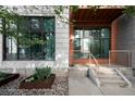 Close exterior view showcasing unique architectural details and landscaping elements at 3100 Huron St # 1B, Denver, CO 80202