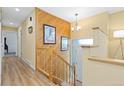 Hallway with wood accents, stairs to the second level, and natural light at 15000 W 29Th Ave, Golden, CO 80401
