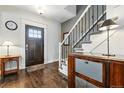Inviting foyer with hardwood floors, stylish staircase, and decorative accents at 2716 N Columbine St, Denver, CO 80205