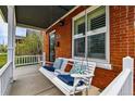 Relax on the front porch swing of this charming brick home at 2716 N Columbine St, Denver, CO 80205