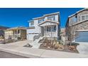 Charming two-story home with a well-manicured front yard and attached garage at 4327 Wilson Peak Dr, Castle Rock, CO 80104