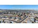 Expansive aerial view of a residential neighborhood with mountain views in the distance at 5367 Spring Ridge Trl, Castle Rock, CO 80104