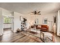Cozy living room featuring stylish decor, modern furnishings, and plenty of natural light at 17731 E Bails Pl, Aurora, CO 80017