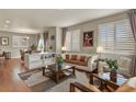 Cozy living room showcasing an open floor plan with an adjacent dining area and modern decor at 4205 E Iliff Ave # 5, Denver, CO 80222