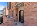 Inviting front entrance to building with unique stone and metal details at 105 Fillmore St # 209, Denver, CO 80206