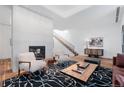 Chic living room featuring modern furnishings and lots of natural light at 105 Fillmore St # 209, Denver, CO 80206