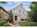 Delightful two-story home with brick patio, outdoor seating, and well-maintained landscaping at 428 N Humboldt St, Denver, CO 80218