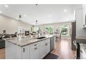 Open concept kitchen featuring granite countertops and stainless steel appliances at 9236 Vrain Ct, Westminster, CO 80031