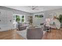 Cozy living room featuring hardwood floors and plenty of natural light at 9400 Ridge Rd, Arvada, CO 80002