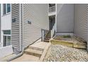 Exterior steps of gray house, featuring address number at 3436 S Locust St # D, Denver, CO 80222